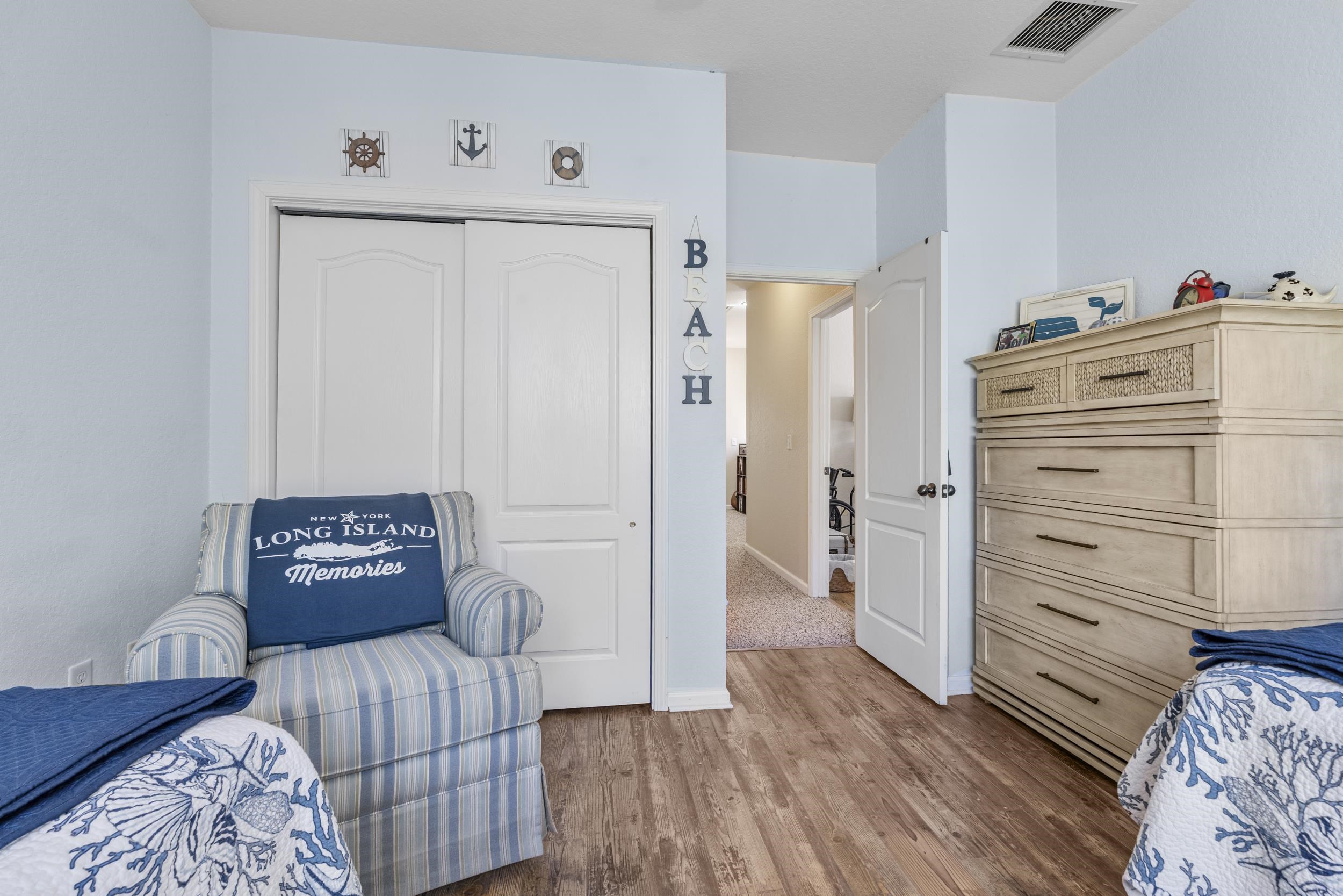 110 Magnolia Crossing Point, Unit 1901 St. Augustine, FL 32086 - Photo 22 of 38 Bedroom featuring a closet and wood finished floors