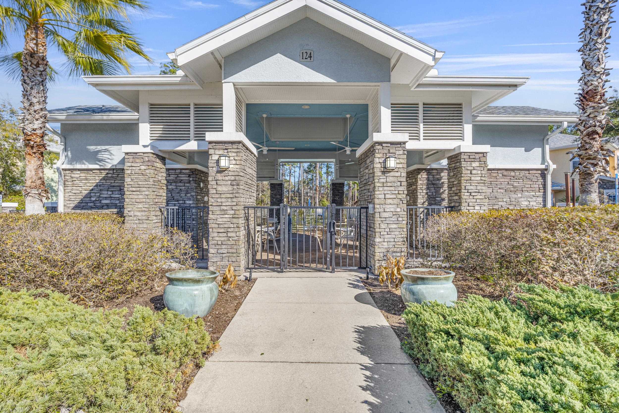 110 Magnolia Crossing Point, Unit 1901 St. Augustine, FL 32086 - Photo 27 of 38 View of building exterior featuring a fenced front yard