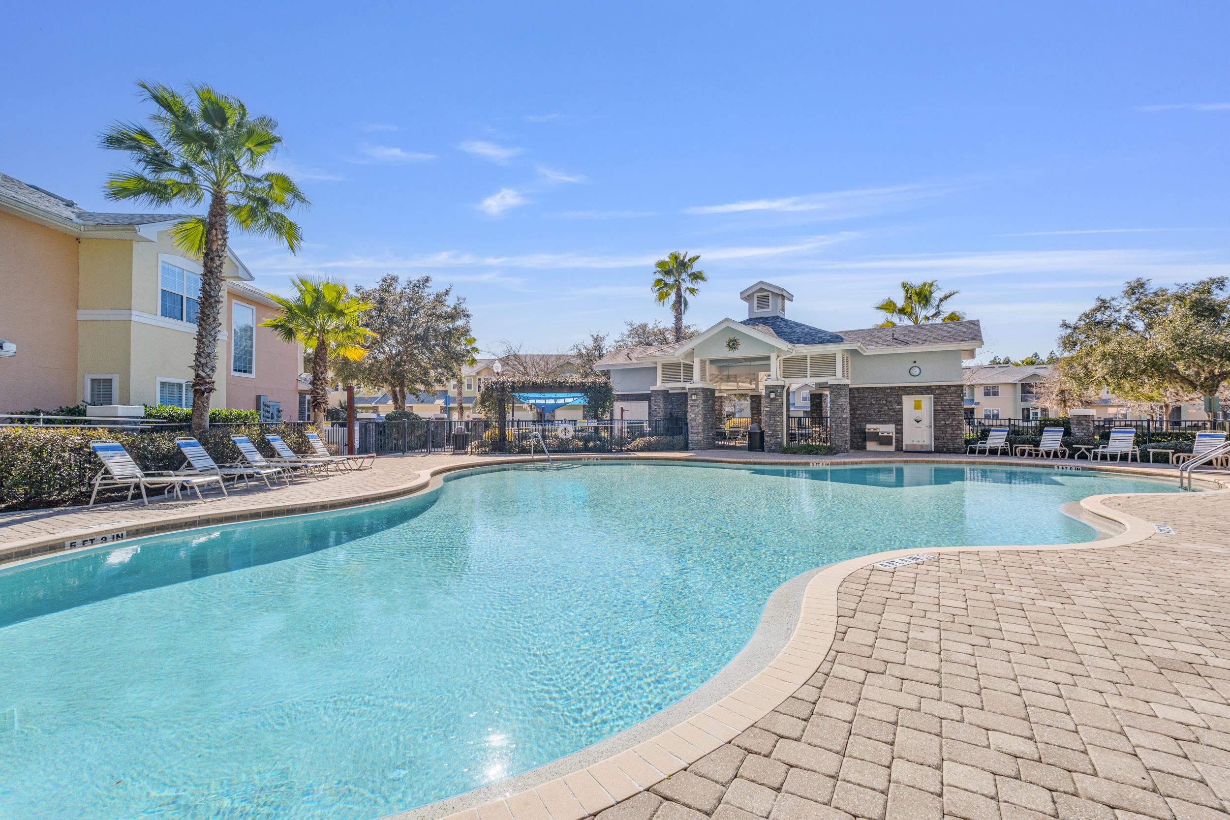 110 Magnolia Crossing Point, Unit 1901 St. Augustine, FL 32086 - Photo 29 of 38 Community pool with a patio area
