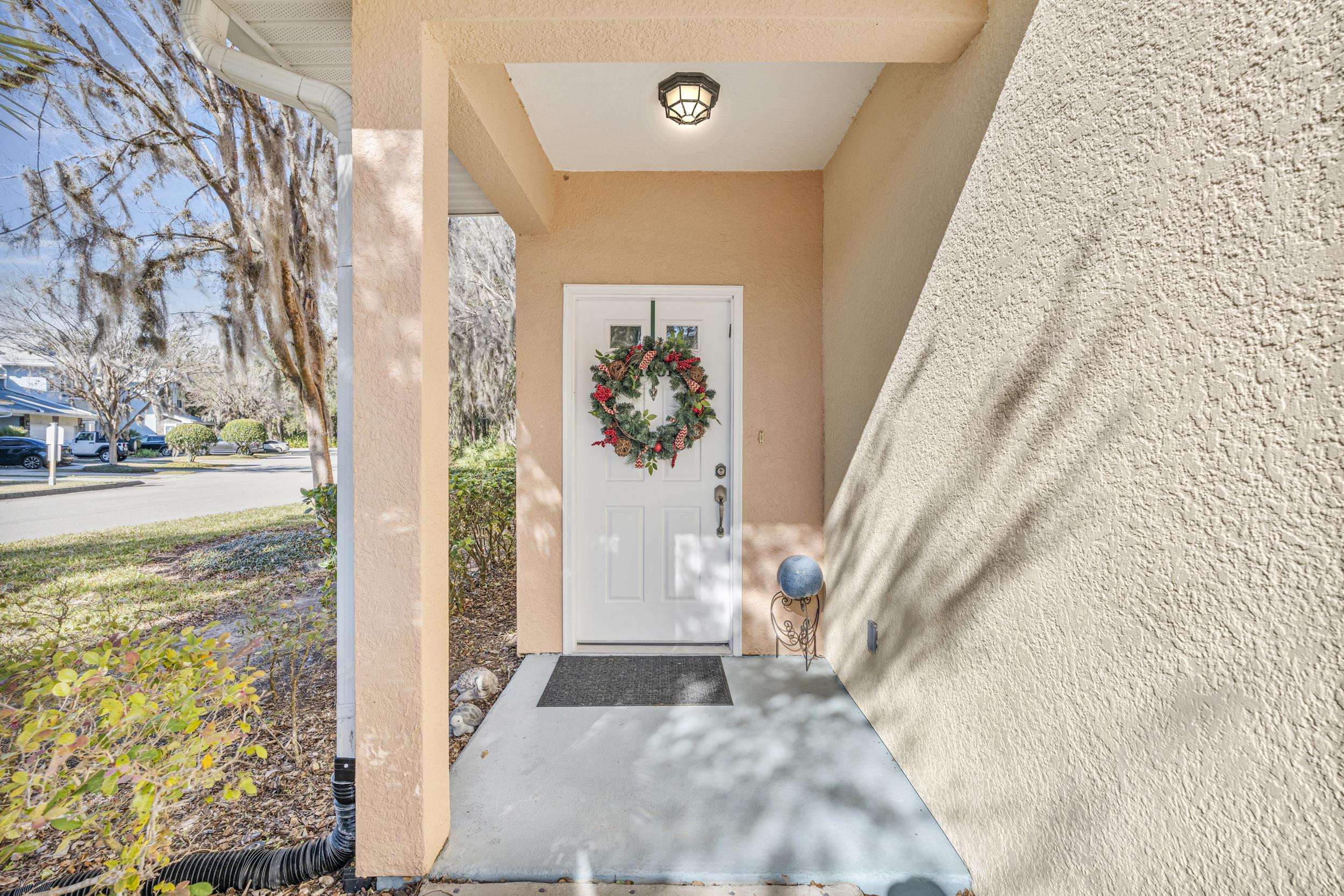 110 Magnolia Crossing Point, Unit 1901 St. Augustine, FL 32086 - Photo 5 of 38 Property entrance featuring a porch and stucco siding