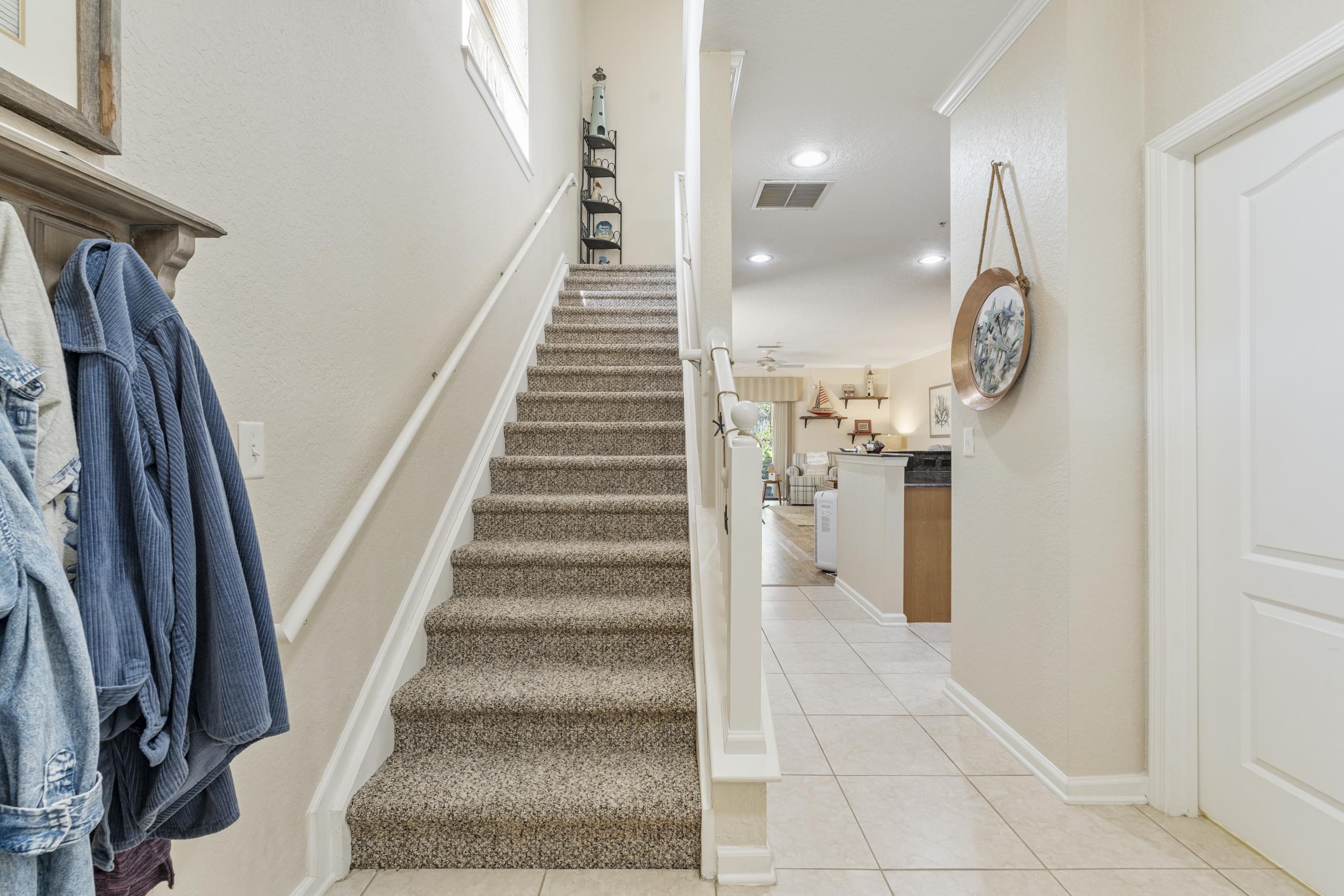 110 Magnolia Crossing Point, Unit 1901 St. Augustine, FL 32086 - Photo 7 of 38 Stairway featuring tile patterned flooring and recessed lighting
