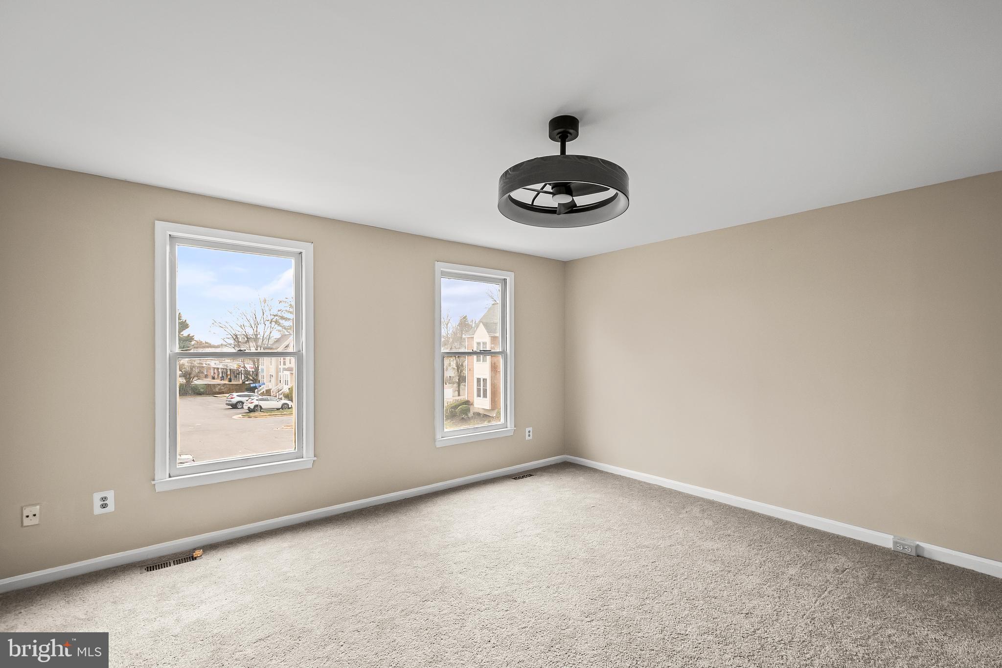 6185 Little Valley Way Alexandria, VA 22310 - Photo 26 of 44 an empty room with windows and fan