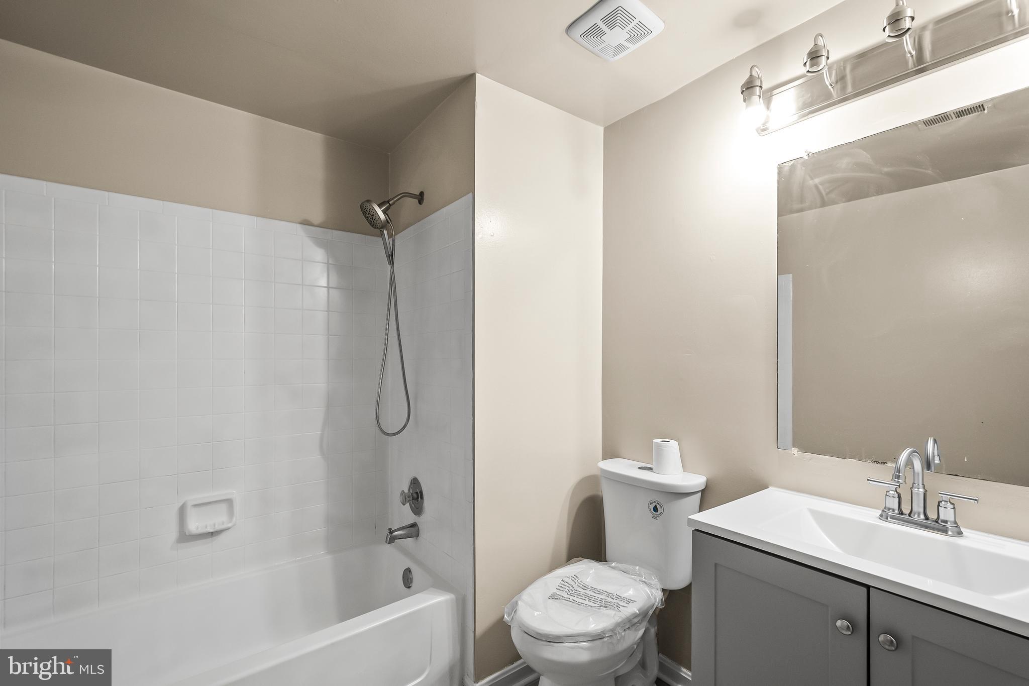 6185 Little Valley Way Alexandria, VA 22310 - Photo 32 of 44 a bathroom with a sink toilet and shower