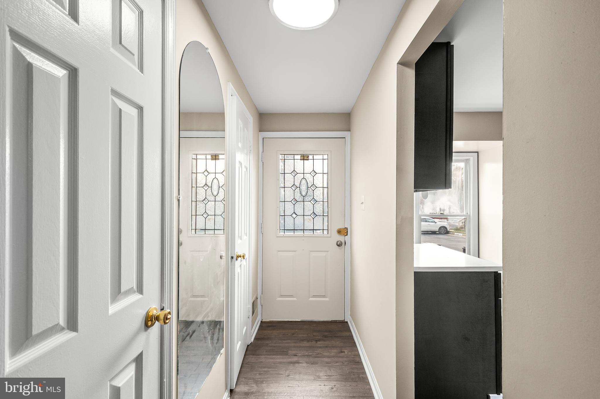 6185 Little Valley Way Alexandria, VA 22310 - Photo 6 of 44 a view of a hallway with a white walls and stairs