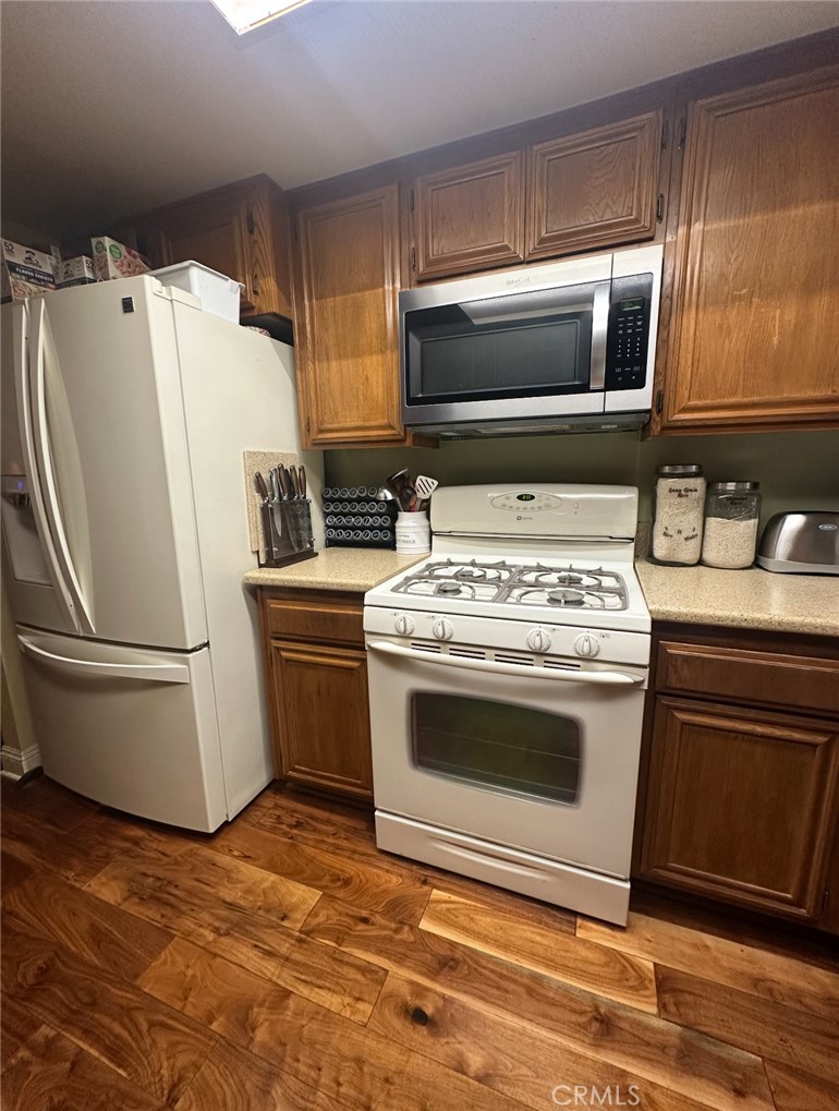 1510 Karon Street Redlands, CA 92374 - Photo 2 of 14 a white stove top oven sitting inside of a kitchen