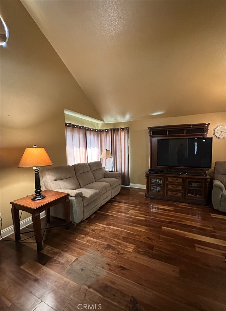 1510 Karon Street Redlands, CA 92374 - Photo 9 of 14 a living room with furniture and a flat screen tv