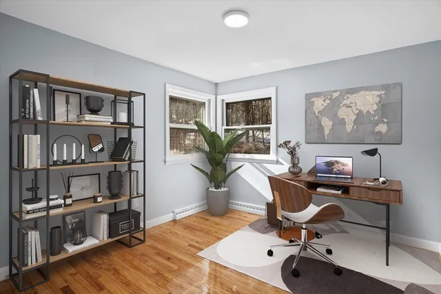 a view of a workspace with furniture and a potted plant