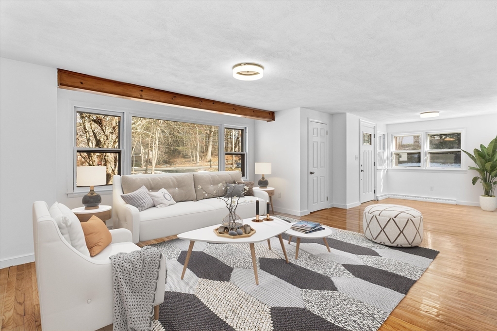260 Great Road Stow, MA 01775 - Photo 1 of 32 a living room with furniture and a window