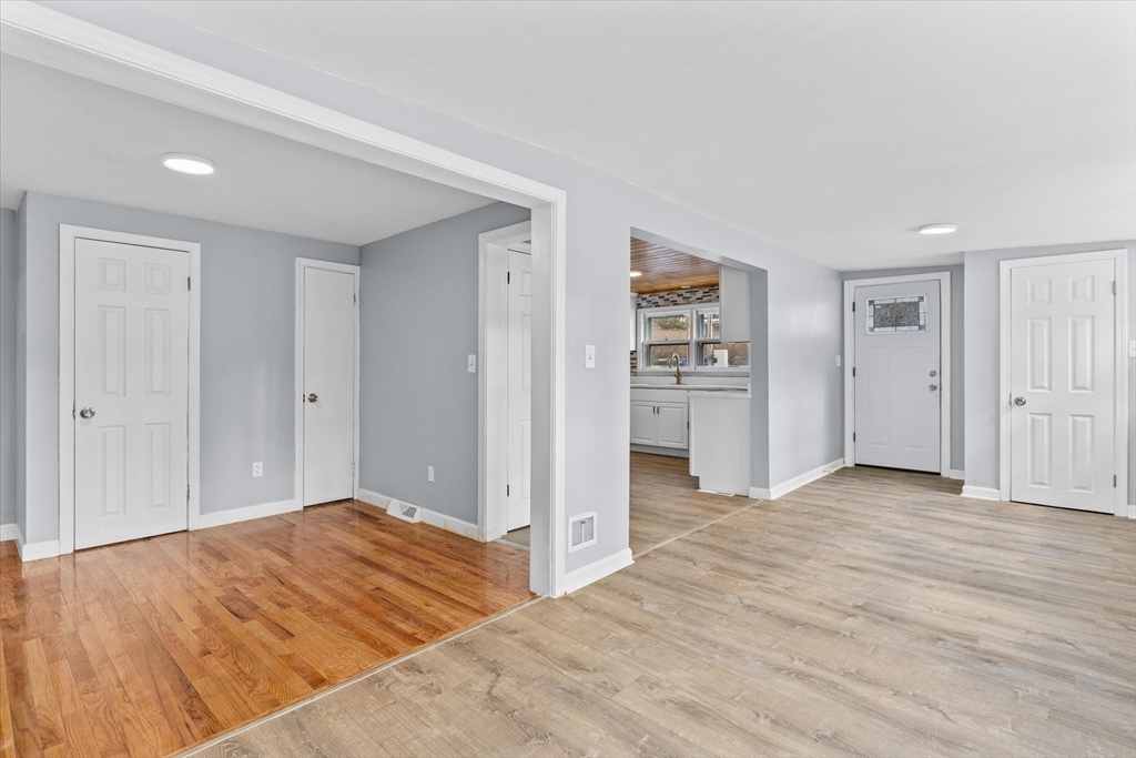 260 Great Road Stow, MA 01775 - Photo 11 of 32 a view of a bedroom with wooden floor & closet area