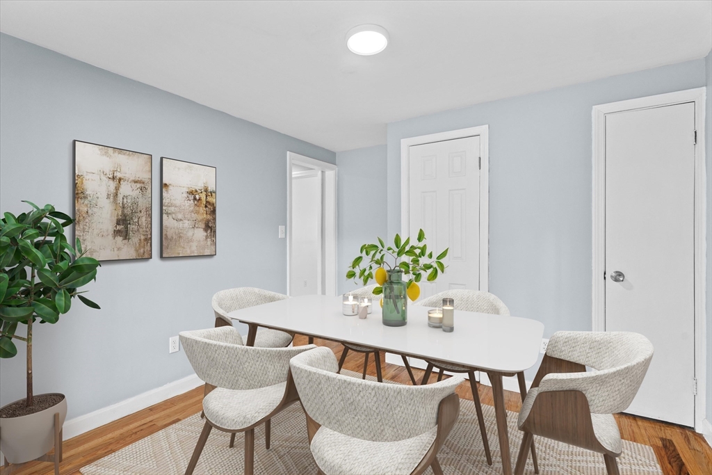 260 Great Road Stow, MA 01775 - Photo 12 of 32 a dining room with furniture and wooden floor