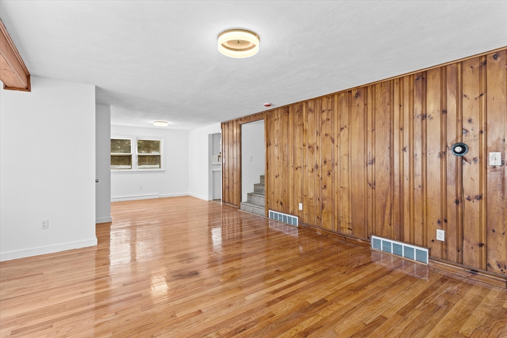 260 Great Road Stow, MA 01775 - Photo 13 of 32 a view of an empty room with wooden floor