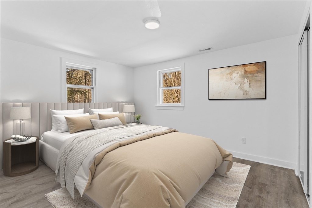 260 Great Road Stow, MA 01775 - Photo 27 of 32 a bedroom with a large bed and a window