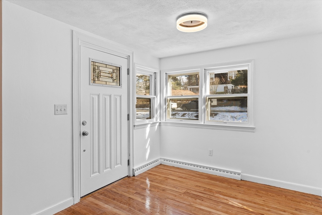 260 Great Road Stow, MA 01775 - Photo 3 of 32 an empty room with a window