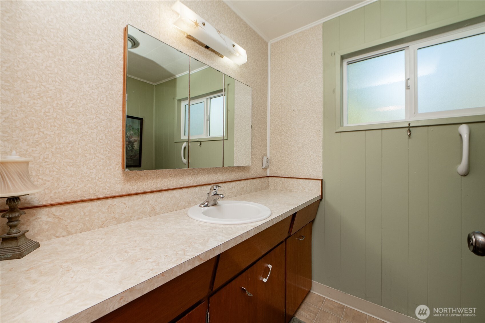 8370 Harborview Road, Unit 15 Blaine, WA 98230 - Photo 12 of 26 a bathroom with a sink and a mirror
