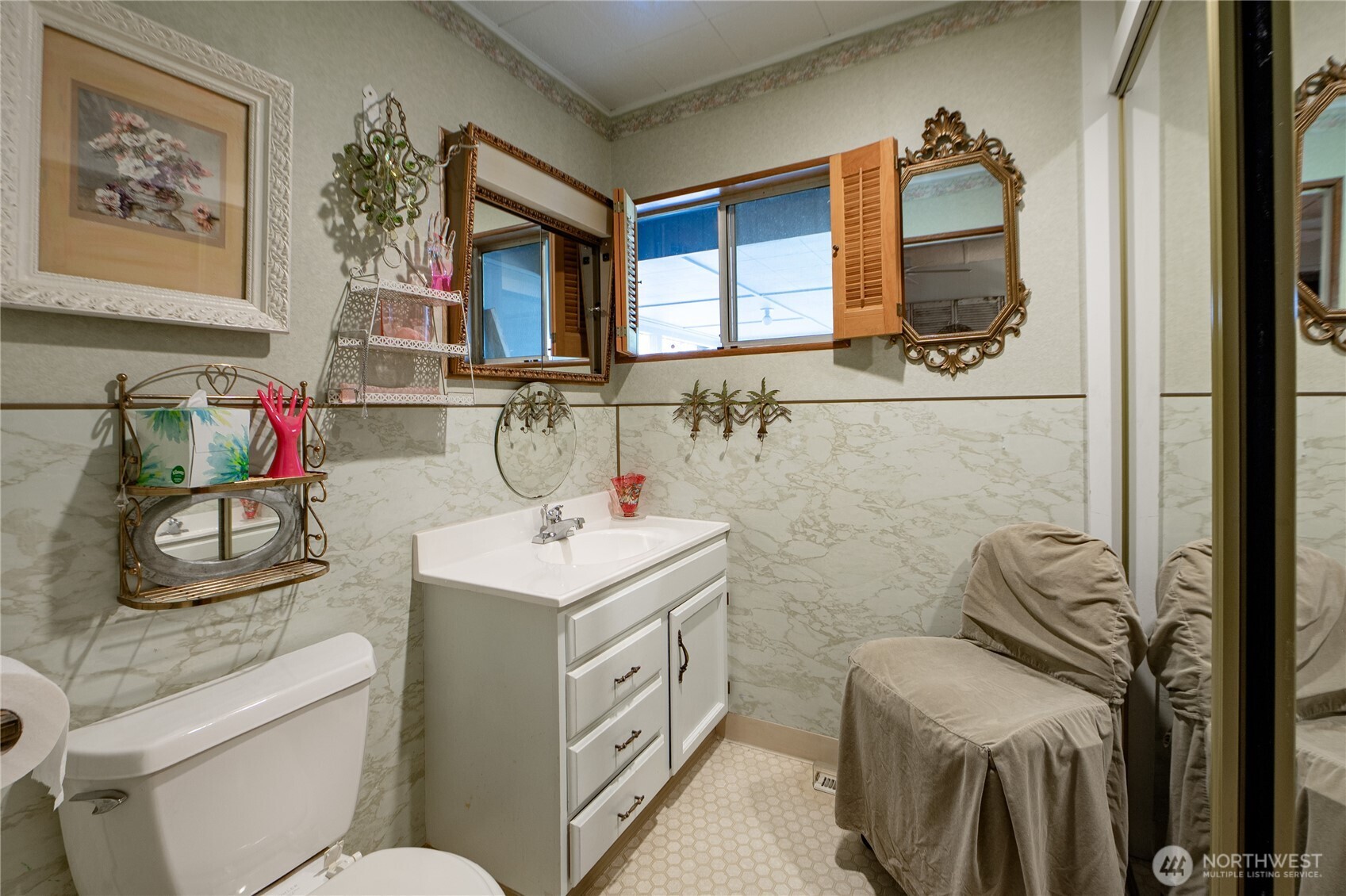 8370 Harborview Road, Unit 15 Blaine, WA 98230 - Photo 13 of 26 a bathroom with a toilet sink and mirror