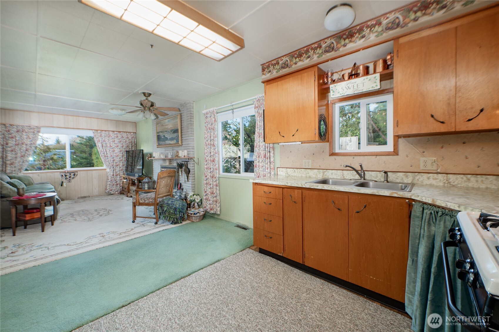 8370 Harborview Road, Unit 15 Blaine, WA 98230 - Photo 8 of 26 a living room with furniture a window and a sink