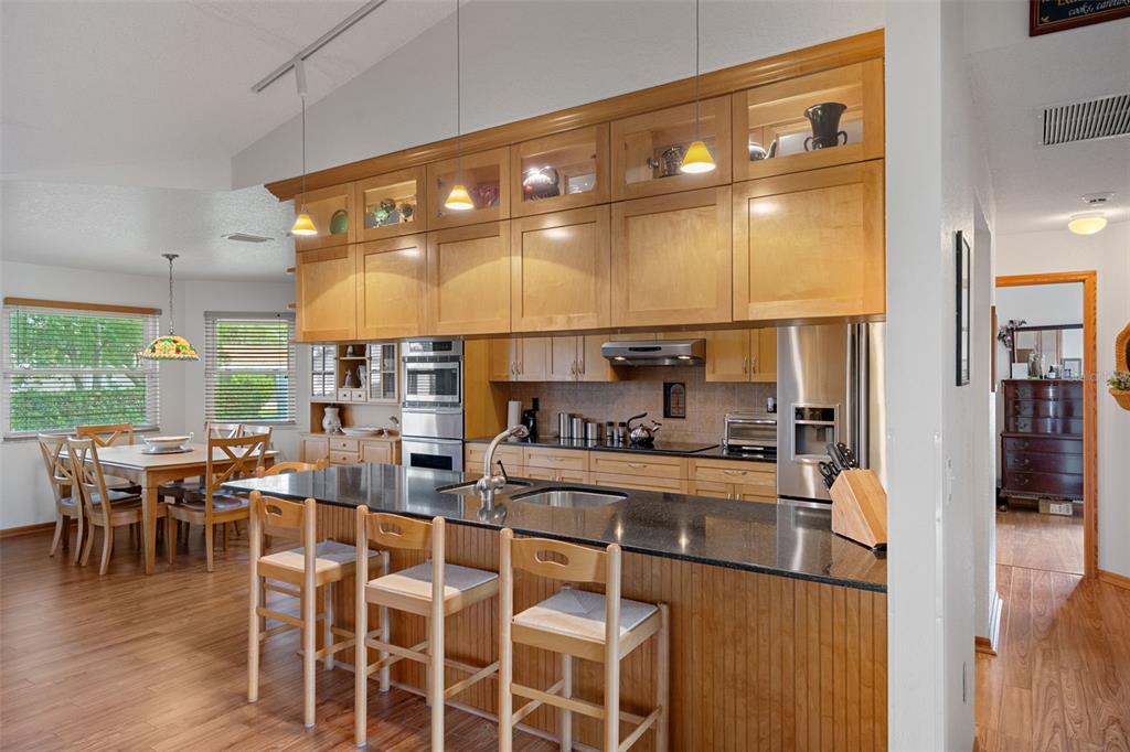 5035 Harbinger Road Spring Hill, FL 34608 - Photo 19 of 47 a large kitchen with a table and chairs