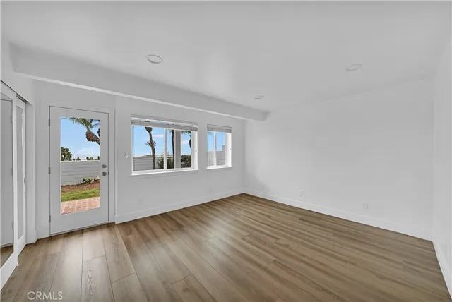 a bathroom with a granite countertop sink and mirror