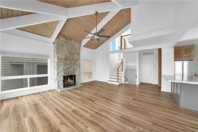 a view of a kitchen with microwave and cabinets