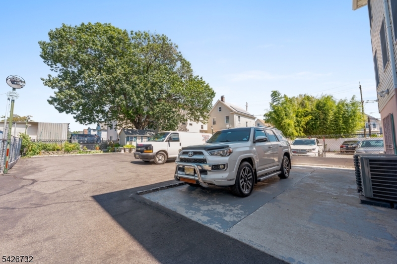 939 Grove Street Elizabeth, NJ 07202 - Photo 16 of 18 a car parked in front of a house