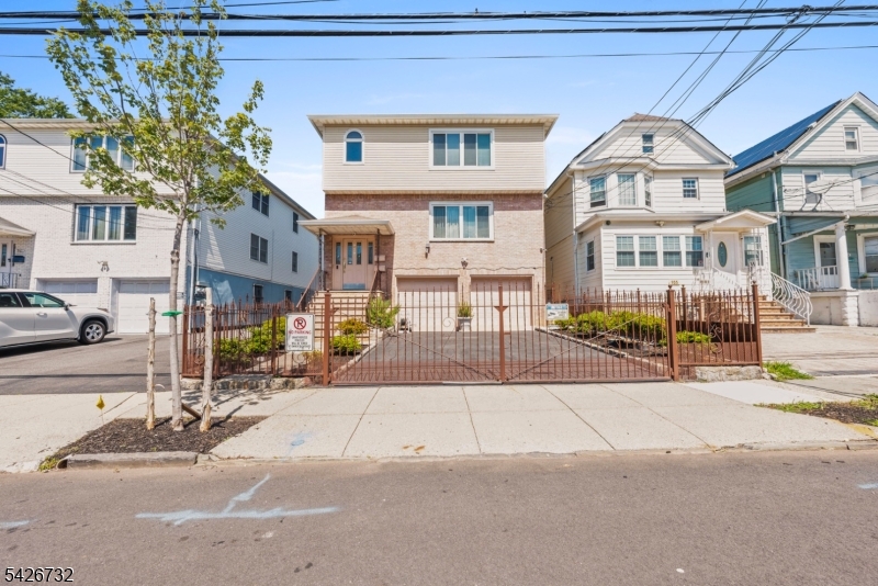 939 Grove Street Elizabeth, NJ 07202 - Photo 2 of 18 a front view of a building with street view