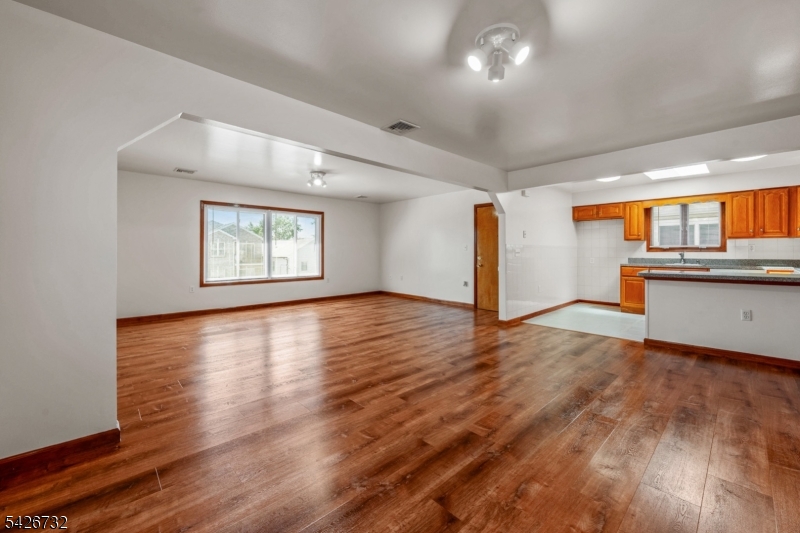 939 Grove Street Elizabeth, NJ 07202 - Photo 6 of 18 a view of a kitchen with wooden floor and a window