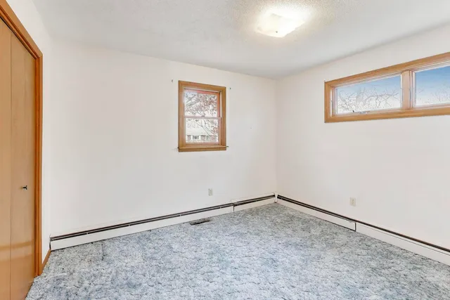 a view of an empty room and window