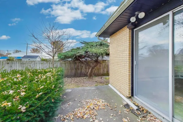 a view of a backyard of the house