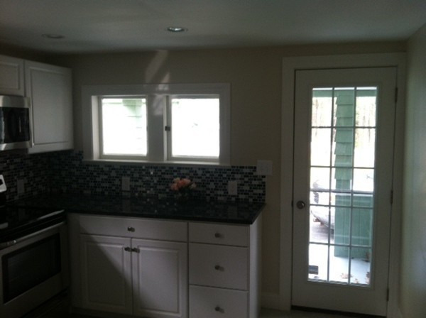 9 Johnson Road Sterling, MA 01564 - Photo 5 of 24 a bathroom with a sink a window and cabinets