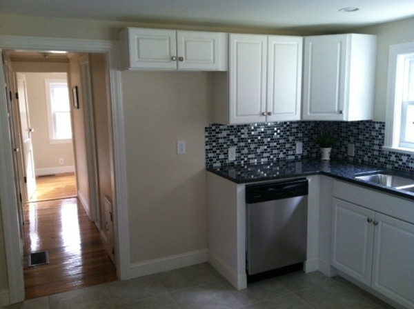 9 Johnson Road Sterling, MA 01564 - Photo 6 of 24 a kitchen with white cabinets and sink