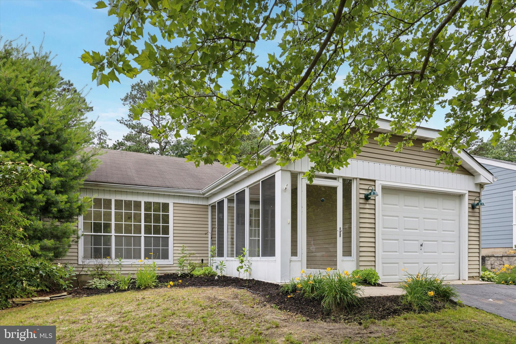 114 Gramercy Place Southampton, NJ 08088 - Photo 2 of 23 a front view of a house with garden