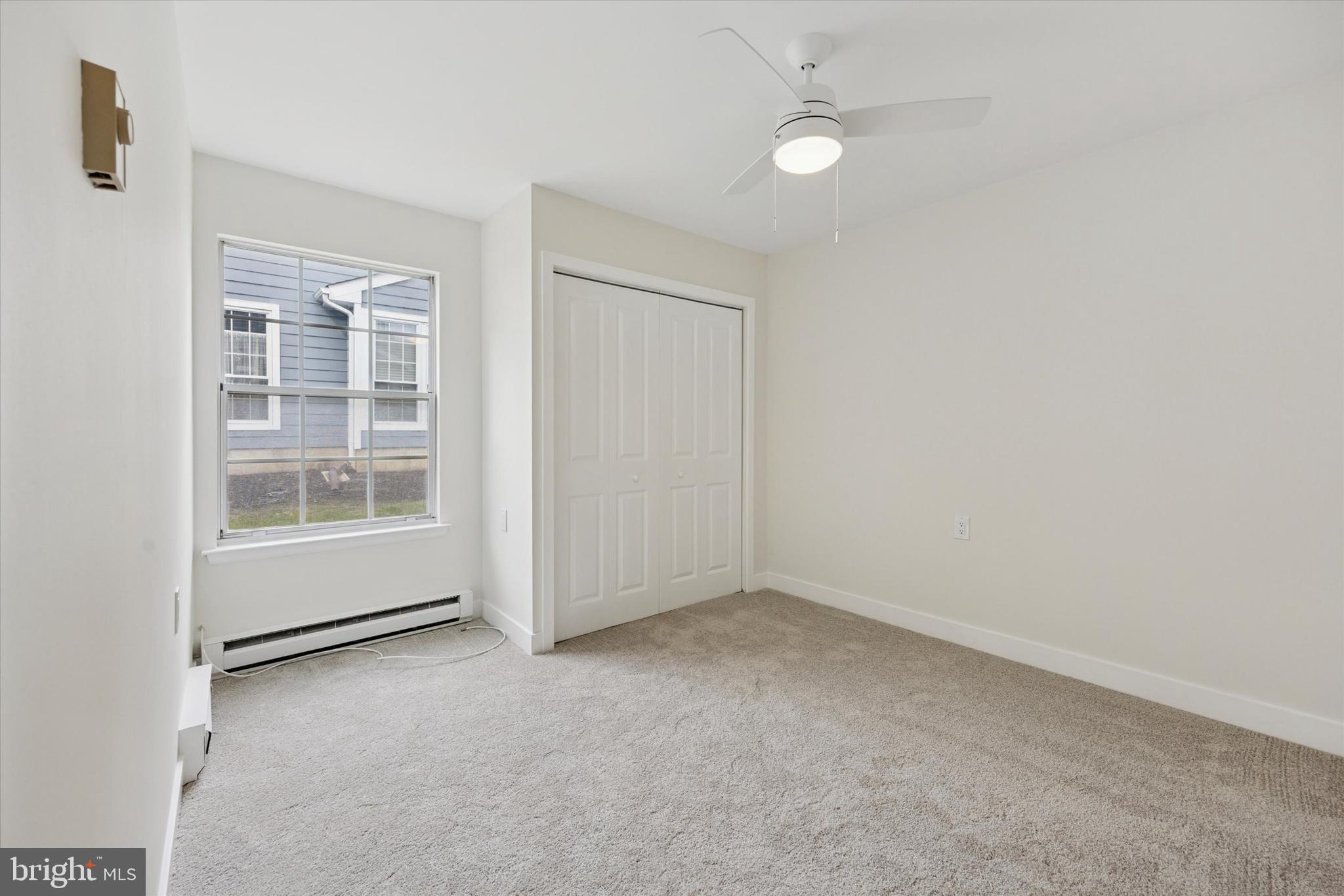 114 Gramercy Place Southampton, NJ 08088 - Photo 21 of 23 an empty room with a empty space and windows