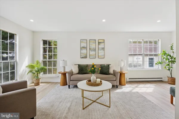 a living room with furniture and windows
