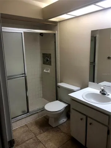 a kitchen with granite countertop a stove sink and cabinets