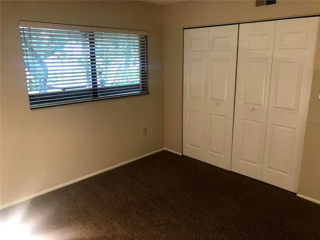 a bathroom with a shower a toilet and sink