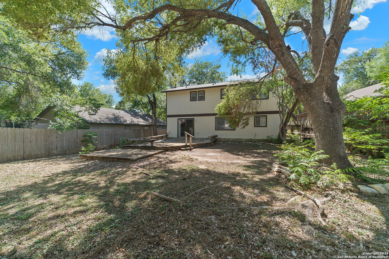 6122 Ridge Oak San Antonio, TX 78250 - Photo 27 of 31 a view of a house with a yard and tree