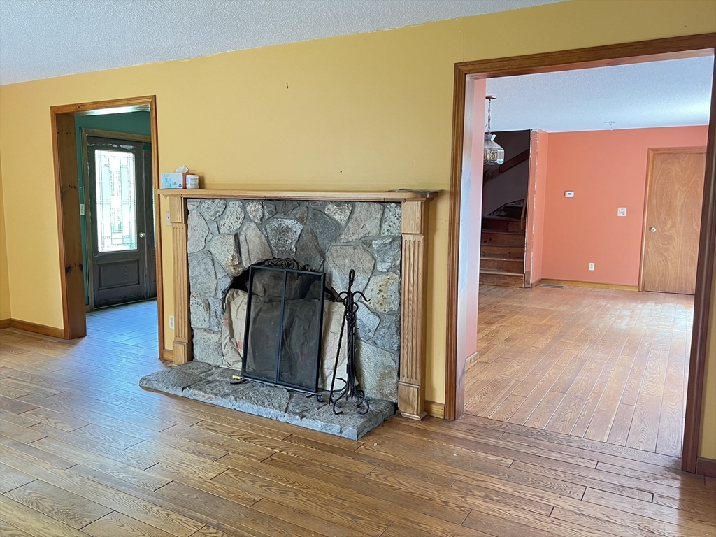 380 Lower Hampden Road Monson, MA 01057 - Photo 15 of 42 a view of a hallway with wooden floor and staircase
