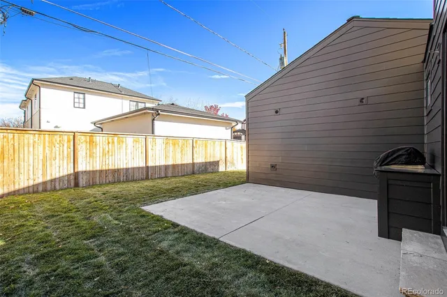 a view of backyard with hardwood and balcony