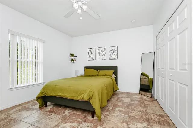 a bedroom with a bed and a dresser