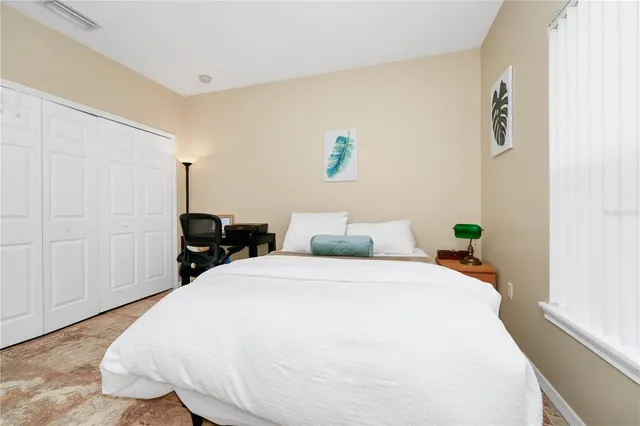 a bathroom with a sink a toilet a mirror and shower