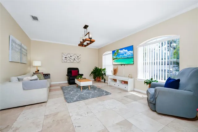 a living room with furniture and a flat screen tv