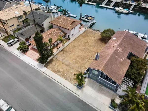 an aerial view of a house with outdoor space