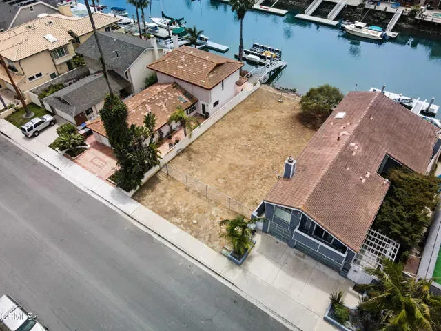 an aerial view of a house with outdoor space