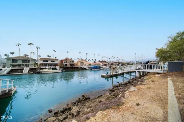 a view of a lake with boats next to a lake