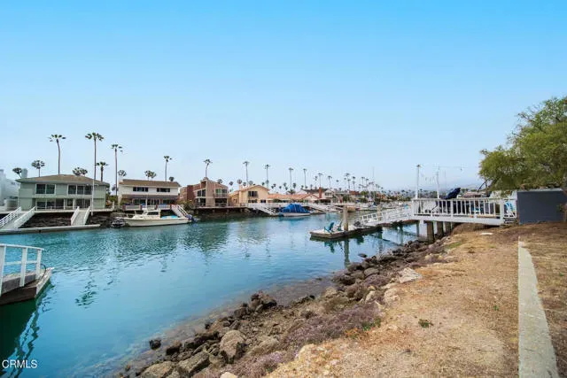 a view of a lake with boats next to a lake
