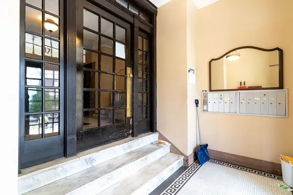 a view of a hallway with a bathroom