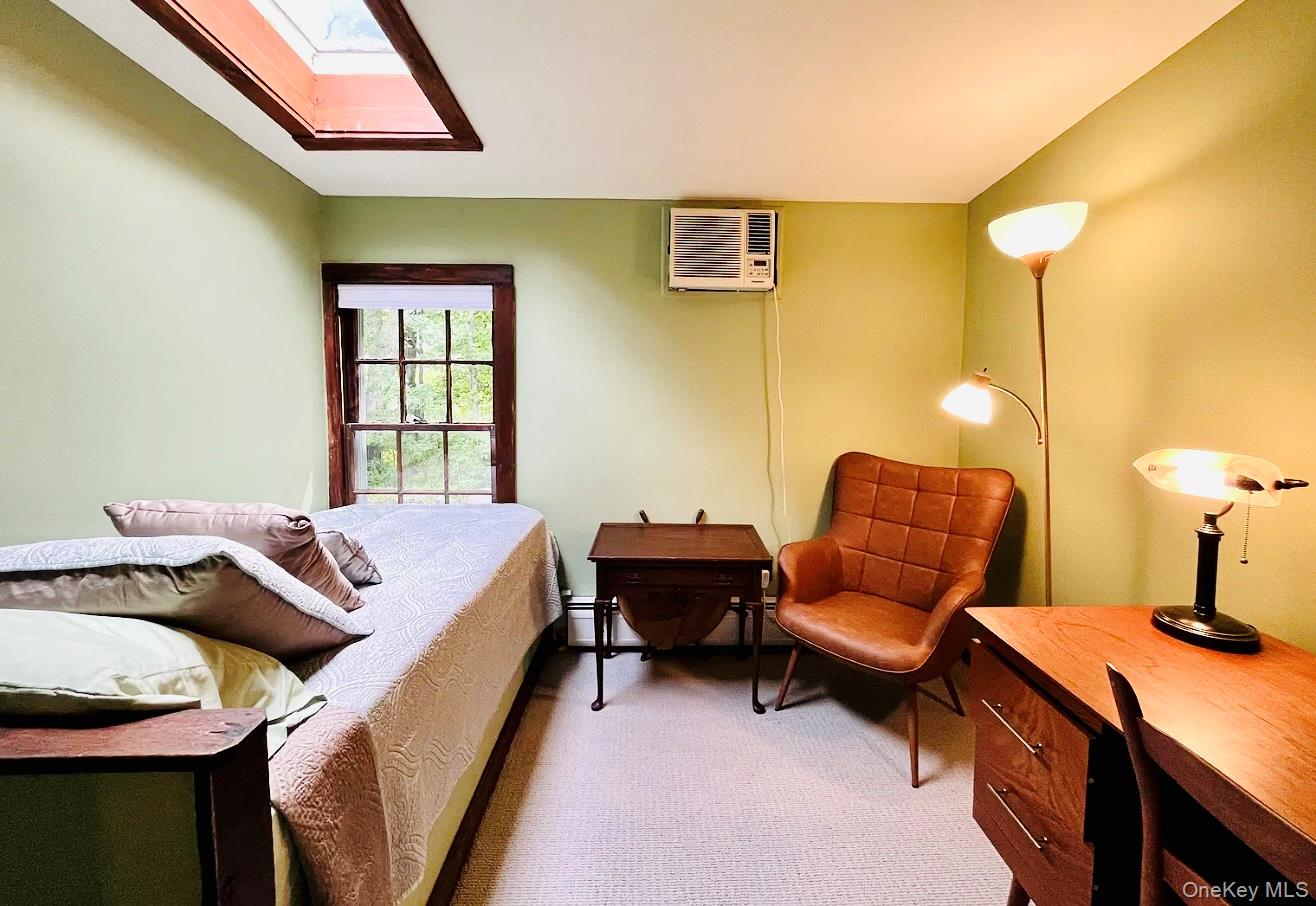 15 Locust Drive Cold Spring, NY 10516 - Photo 7 of 15 a bedroom with a bed and wooden floor