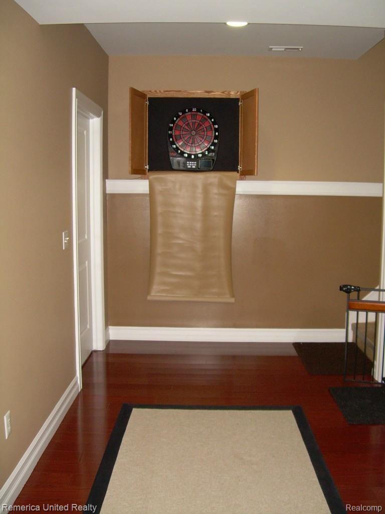 3467 East Commerce Road Commerce Township, MI 48382 - Photo 21 of 36 Entry to lower level from upper level staircase