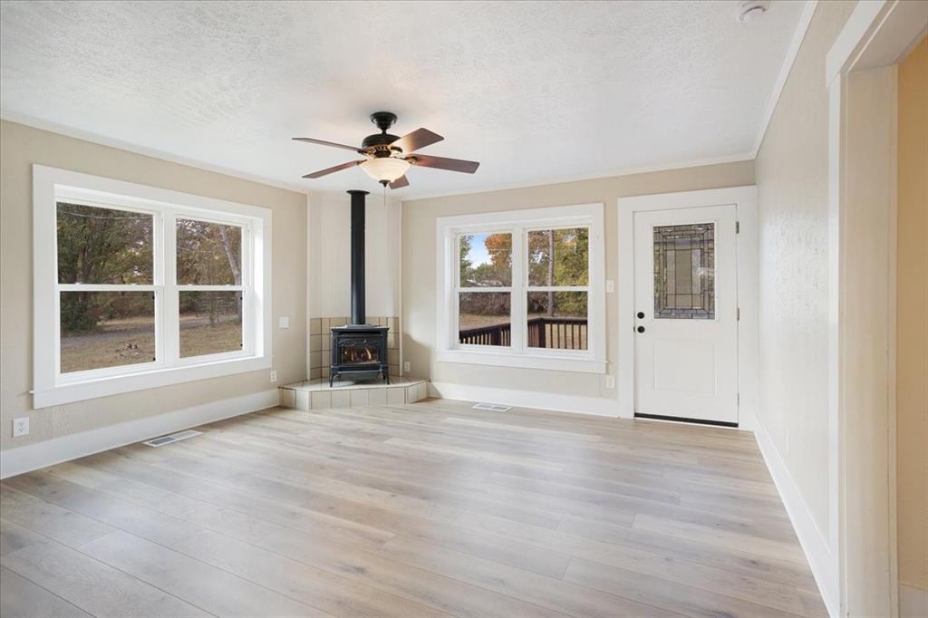 40 Sheryl Lane Denison, TX 75021 - Photo 14 of 40 a view of an empty room with a window and wooden floor