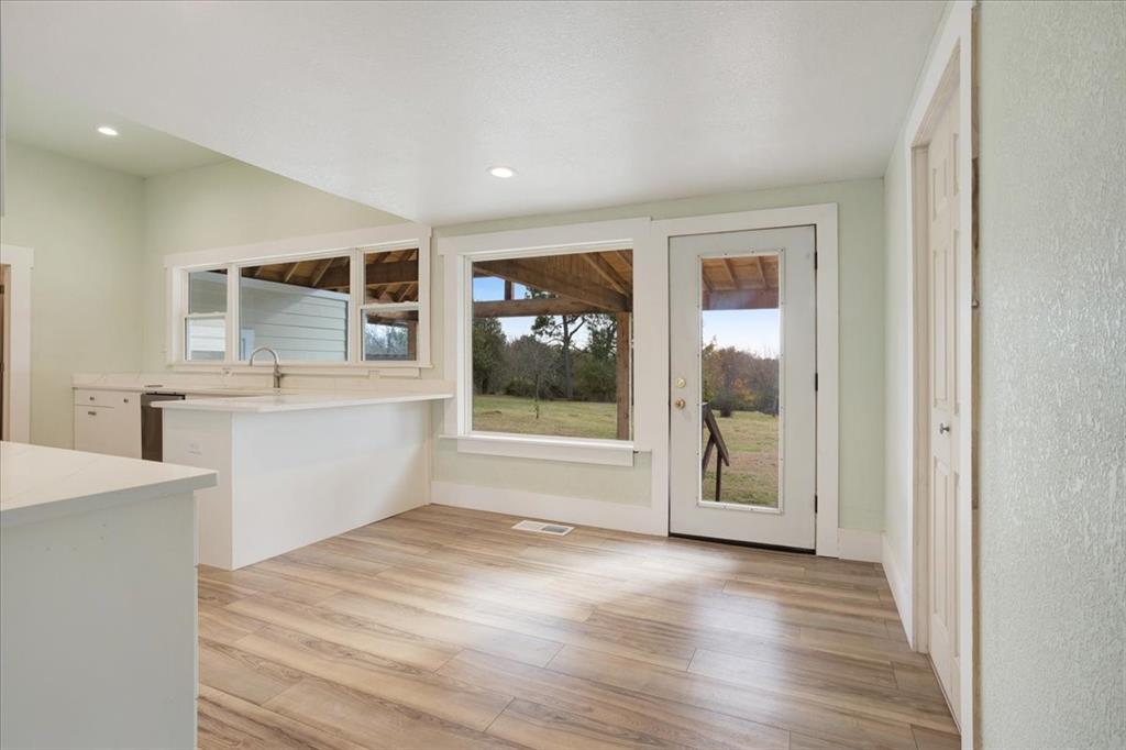 40 Sheryl Lane Denison, TX 75021 - Photo 17 of 40 a view of a kitchen cabinets a sink and a window